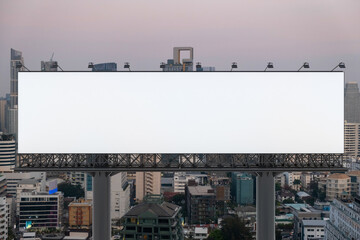 Obraz premium Blank white road billboard with Bangkok cityscape background at sunset. Street advertising poster, mock up, 3D rendering. Front view. The concept of marketing communication to promote or sell idea.