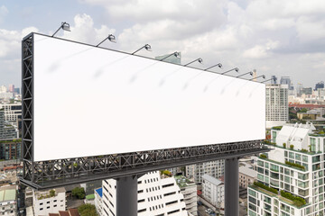 Fototapeta premium Blank white road billboard with Bangkok cityscape background at day time. Street advertising poster, mock up, 3D rendering. Side view. The concept of marketing communication to promote or sell idea.