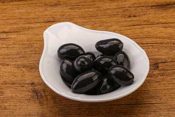 Pickled black olives in the bowl