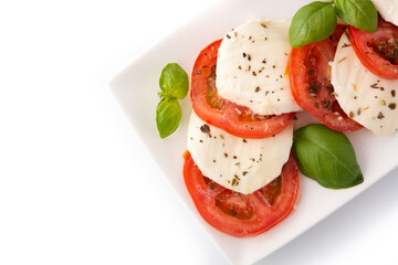 Traditional caprese salad with tomato and mozzarella cheese isolated on white background 
