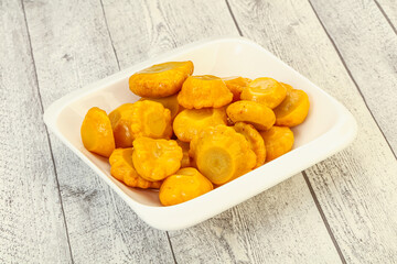 Marinated yellow patisson in the bowl