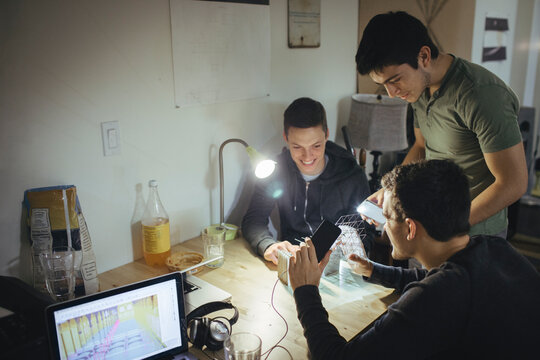 Architecture Students Discussing Structural and Computer Generated Models at Home