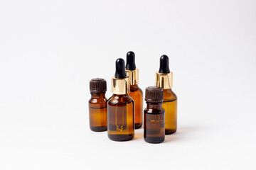 A set of amber bottles for essential oils and cosmetics. Glass bottle. Dropper, spray bottle