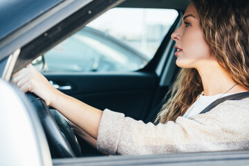 Fototapeta na wymiar Woman driving her car stock photo