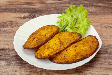 Baked potato with herbs and spices
