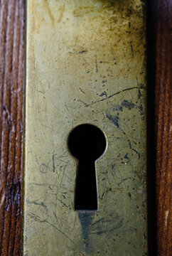 Old brass keyhole on a door