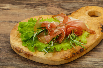 Sliced pork Jamon with rosemary