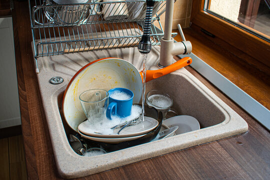 Dirty Dishes In Sink.