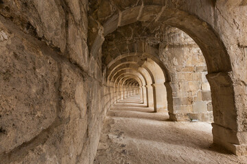 Fototapeta na wymiar Arches in the gallery section of the Roman amphitheater at Aspendos, Turkey.