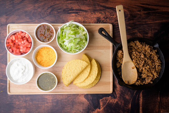 hard shell taco ingredients on wooden board