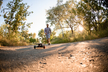view on skateboard and man in plaid shirt approaches to it