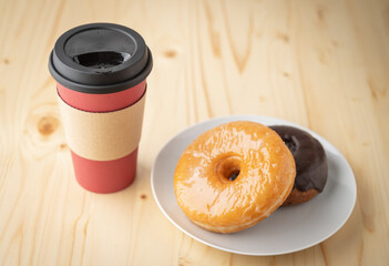 doughnut with coffee in paper cup