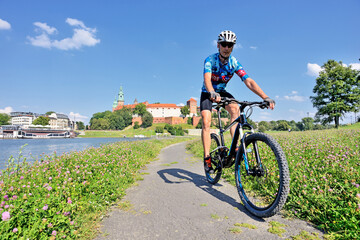 A man on a mountain bike- Cracow- Poland.	 - obrazy, fototapety, plakaty