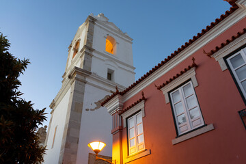 Pink building in front of Santa Maria church. Magic light at dusk. Lagos, Portugal