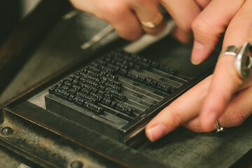 Woman Working with Lead Press Types