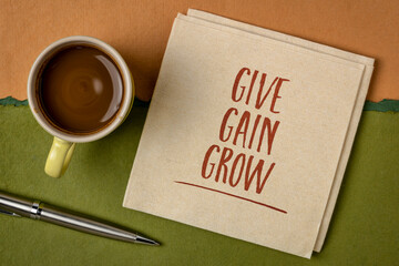 give, gain and grow - business and personal development concept - handwriting on a napkin with a cup of coffee