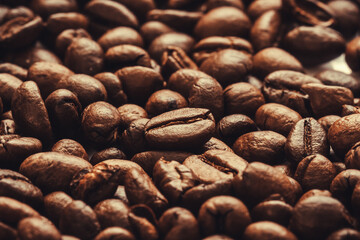 Roasted coffee beans background. international day of coffee. Close up. Selective focus