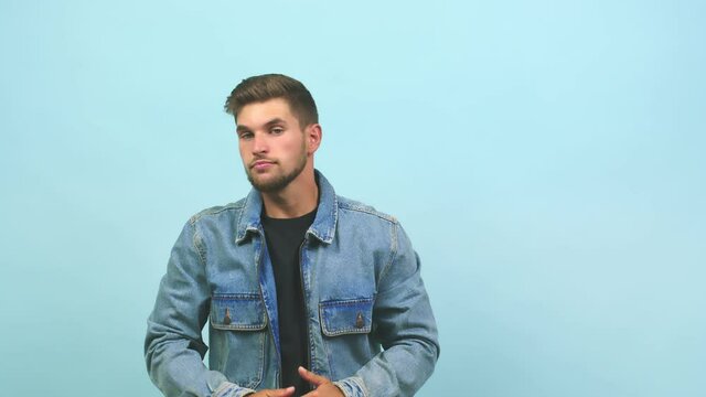 Young caucasian handsome man tired and bored, doing a timeout gesture, needs to stop because of work stress, time concept