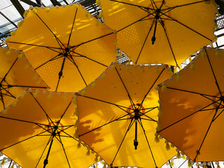 Fototapeta premium yellow umbrella against blue sky