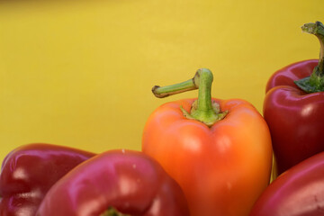 on a yellow background with space for text colorful ripe peppers. Banner advertising vegetables