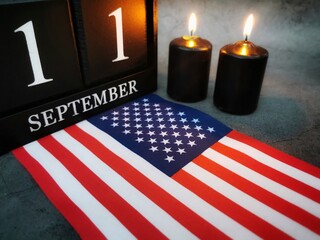 September 11th. Patriot Day and Memorial concept.
Two burning candles with United States of America...