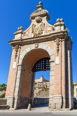 Fototapeta na wymiar Alcantara Bridge against Toledo cityscape, Castilla La Mancha