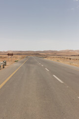 road in desert in Big Ramon crater in Israel.
