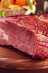 Piece of bacon on the wood cutting board - Close-up