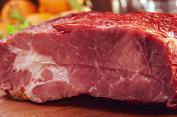 Piece of bacon on the wood cutting board - Close-up