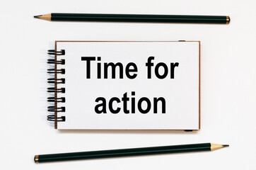 WHITE SPIRAL NOTEBOOK, TWO PENCILS WITH TEXT TIME FOR ACTION