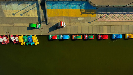 Parking of water bicycles on the river that leads in Ukraine. Water bicycles are a popular tourist attraction.