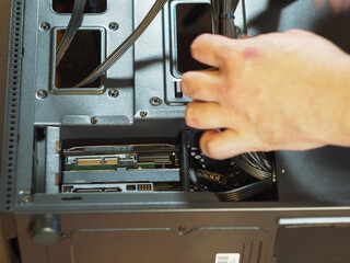 installing a hard disk in a computer block. the Assembly of a personal computer. workshop. HDD