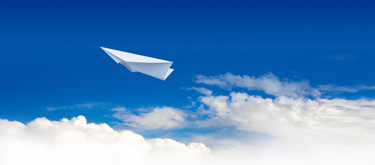 Naklejka na ściany i meble Paper plane in the blue sky.