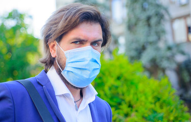 Bearded man with protective mask. Coronavirus. Epidemic. Businessman with protective mask. Protect. Healthcare.