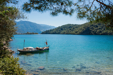 Fototapeta na wymiar Turkish coastline with turquoise color water of the Aegean Sea, in Oludeniz, Fethiye, Turkey