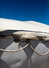 detail of a old white painted iron lifeboat