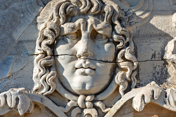 Antique relief representing head of Medusa, in the ruins of the Temple of Apollo in Didyma, Aydin, Turkey