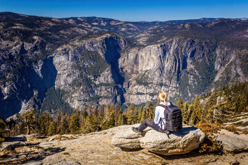 Backpacking in the Yosemite National Park, woman enjoying the view