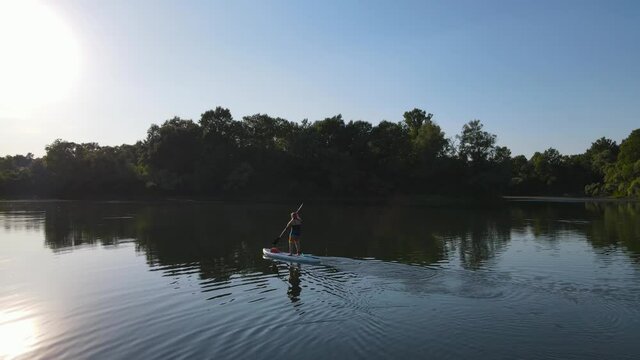 Water rides on sup boarde .