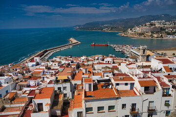 Obraz premium View of the Peniscola town Valencia, Spain. Tourism, Spanish landscape with deep blue sea and mediterranean architecture. 