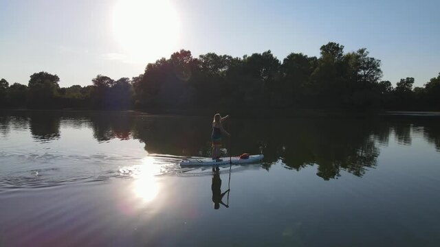 Water rides on sup boarde .