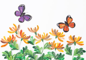 Beautiful butterflies and yellow flowers, isolated on white background. Hand made of paper quilling technique.