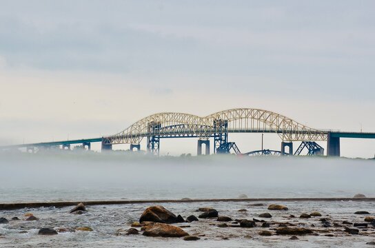 The Sault Ste. Marie International Bridge Over St. Marys River, A View In Foggy Morning