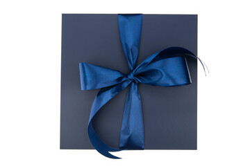 Dark navy blue gift box with blue ribbon on white background. Top view.