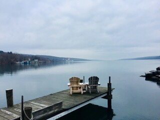 Wooden pier on the Seneca Lake, New York, in a foggy day