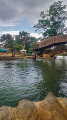 Fototapeta premium wodden bridge in the source of the tioyacu river in rioja tarapoto peru