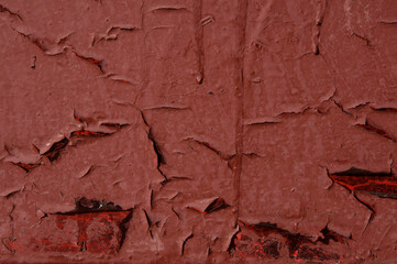 Texture of old red rusty painted metal wall with smudges closeup