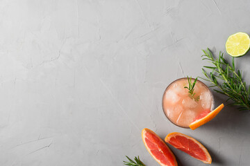 Grapefruit sparkling cocktails or lemonade garnish rosemary. View from above. Close up.