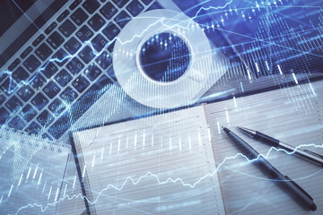 Stock market chart and top view computer on the table background. Double exposure. Concept of financial analysis.