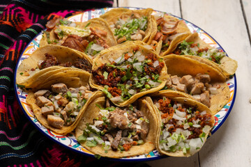 Assortment of mexican tacos on white background